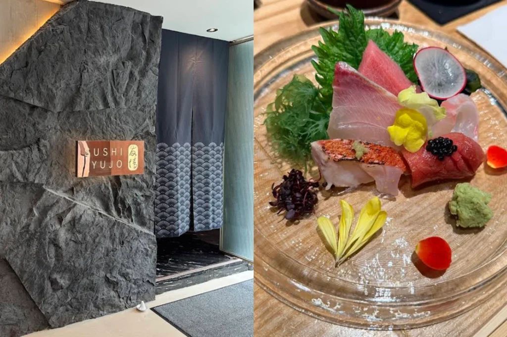 This horizontal composite showcases the entrance to Sushi Yujo, where a copper-toned backlit sign is embedded into a rugged, dark grey stone wall next to a navy blue noren featuring a traditional white wave pattern. Beside it, a top-down view of a premium sashimi platter on a clear glass plate highlights thick slices of tuna, sea bream, and seared snapper topped with black caviar and micro-herbs, elegantly garnished with yellow flower petals, a red rose petal, and a mound of fresh wasabi.