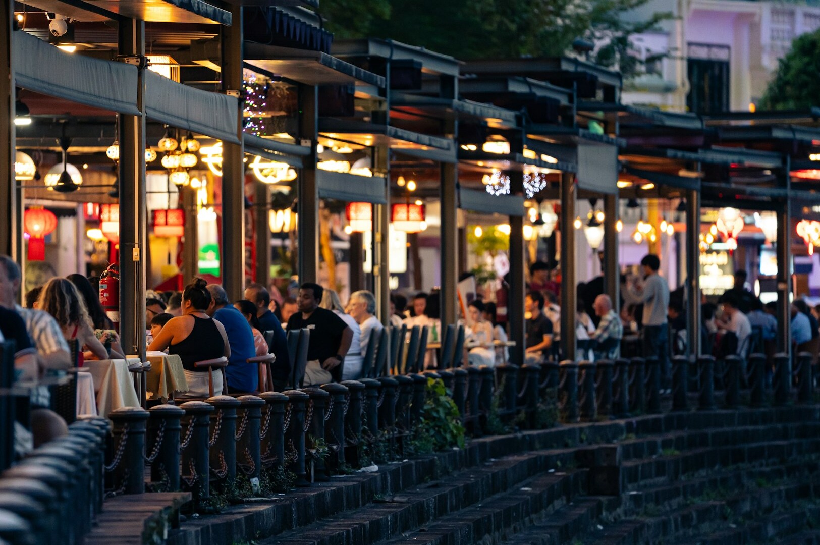  A row of tables and chairs set up for dining in a Japanese restaurant, highlighting the ambiance for omakase experiences.