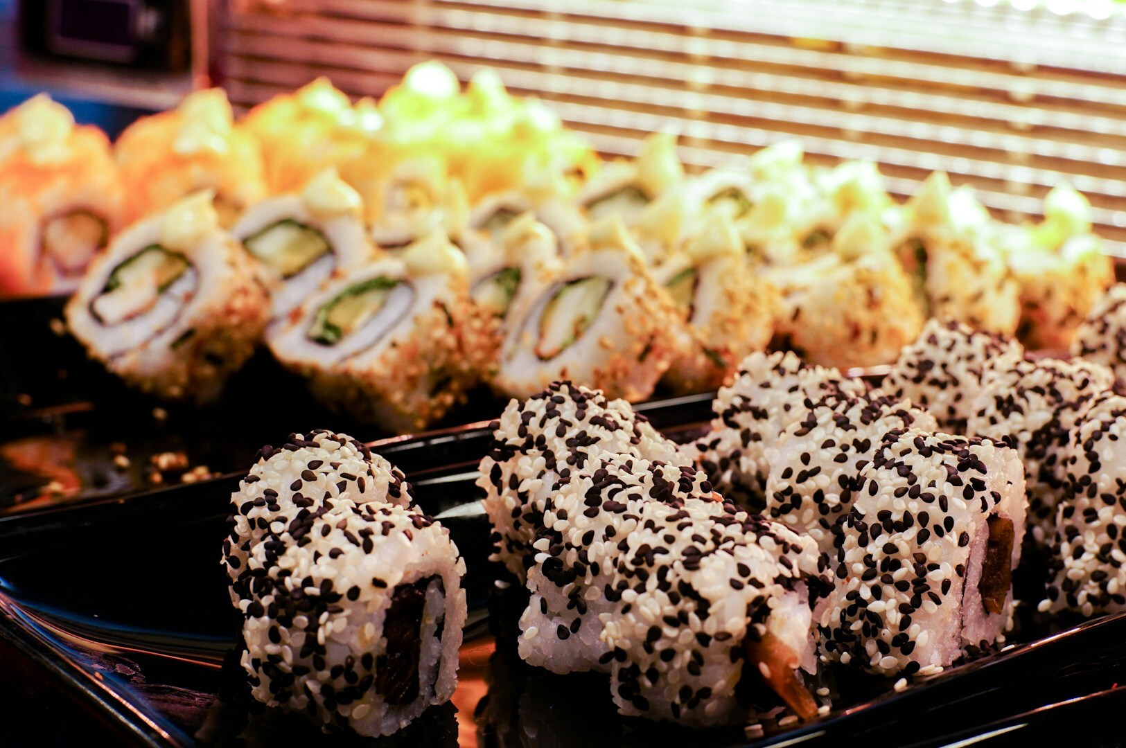 An assortment of sushi rolls and various dishes arranged attractively, enhancing the sushi buffet experience for diners.