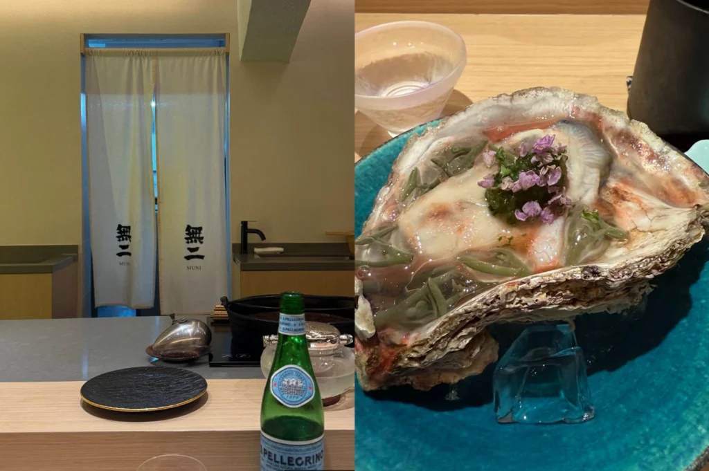 A split-screen view of a minimalist entrance and a fresh seafood course. The left side captures a clean, bright doorway covered by a white noren curtain with black Japanese calligraphy reading "Muni," set against a simple wooden counter with a bottle of sparkling water. The right side presents a large, rugged oyster shell served on a vibrant teal plate, containing a chilled oyster topped with a clear dashi jelly, green sea grapes, and delicate purple shiso flowers.