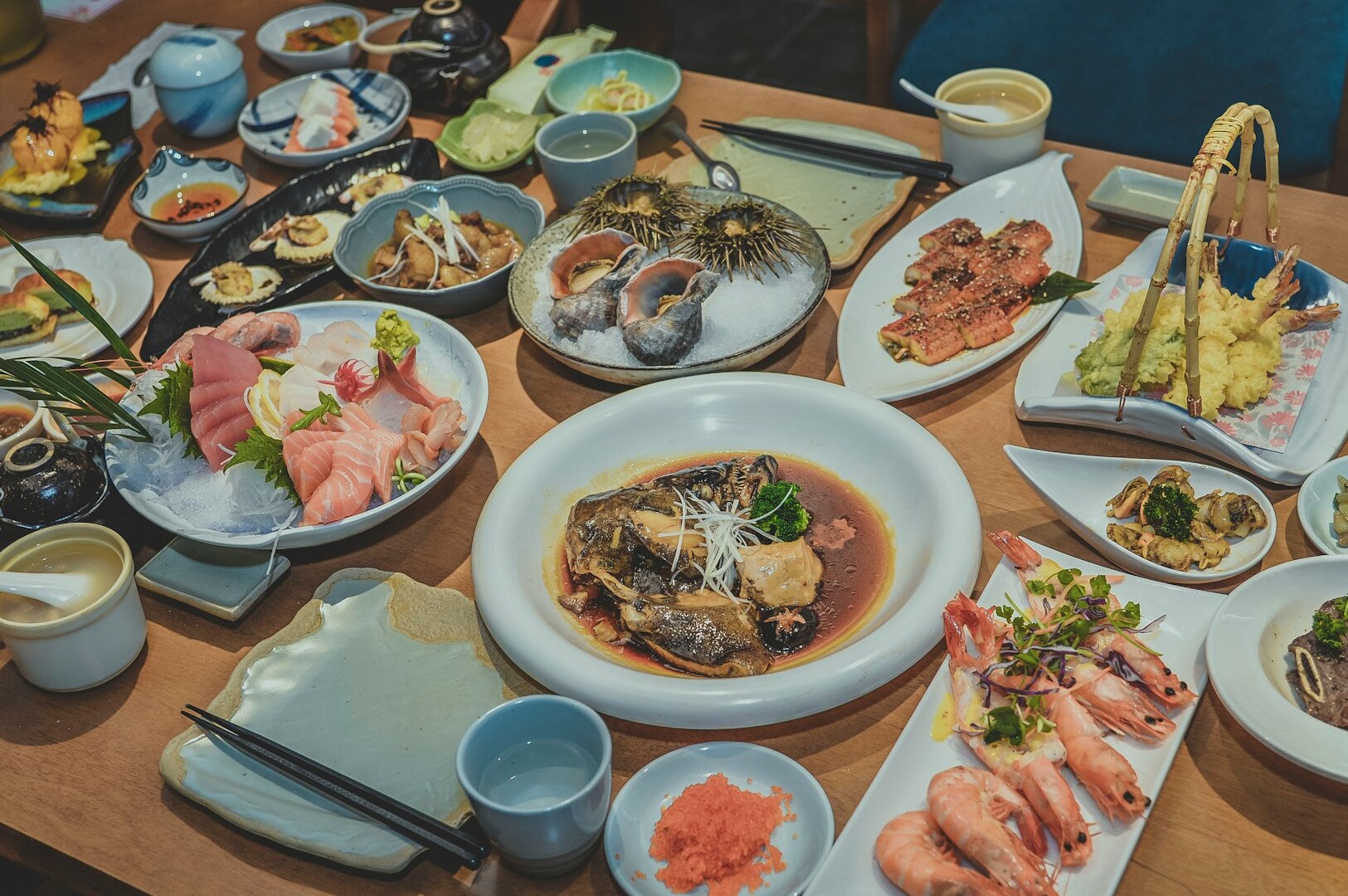 An array of food and beverages displayed on a table, highlighting a Japanese buffet experience in Singapore.
