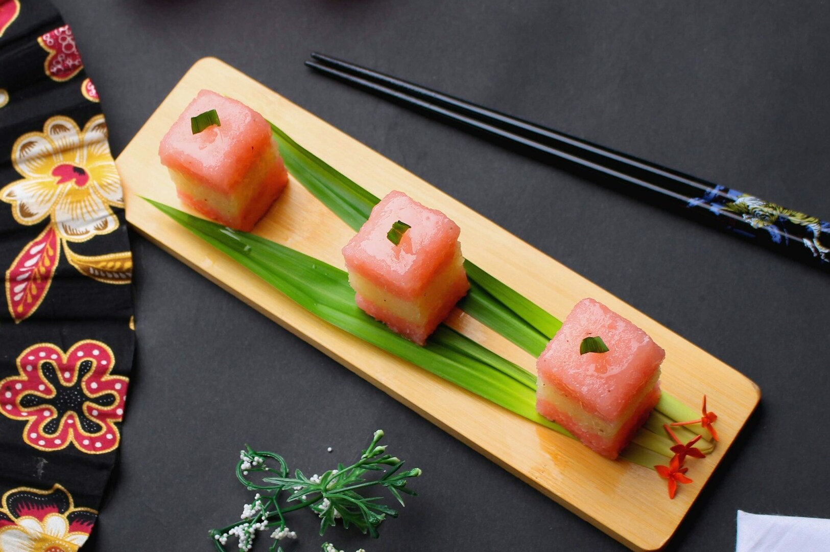 The image showcases a beautifully plated Japanese fusion dish, featuring vibrant garnishes that enhance its distinct flavor profile. This high-quality Japanese fare is designed to delight the taste buds of a new generation of diners, embodying omote's philosophy of offering delicious and innovative cuisine.