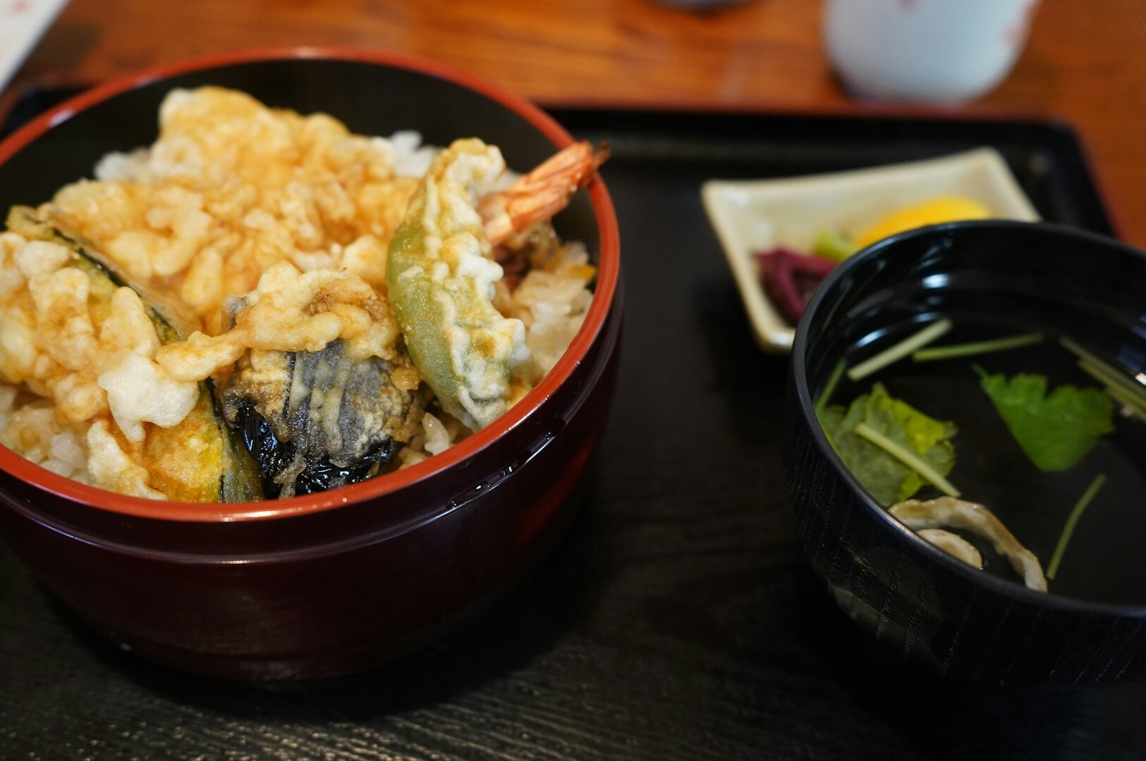 A tray featuring a bowl of rice and assorted seafood, presented at Omote Thomson Plaza - Japanese Food Delights.