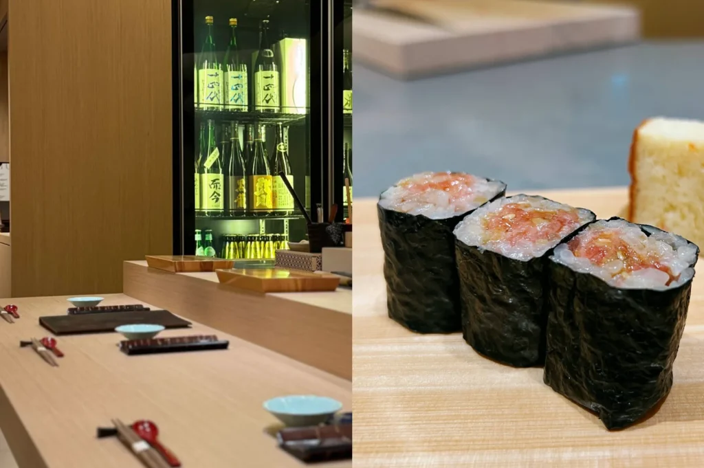 A side-by-side split layout focusing on the bar setup and the sushi offerings. The left side captures an empty, multi-tiered wooden sushi counter neatly set with small light-blue sake cups, chopsticks, and dark rectangular stone blocks, with a glowing glass-door refrigerator in the background tightly packed with various premium bottles of Japanese sake. The right side shows a close-up, macro shot of three thick gunkan sushi rolls wrapped tightly in dark, textured nori seaweed, overflowing with a rich, translucent minced fish mixture, with a piece of light-colored tamago (egg omelet) sitting slightly blurred in the background on the clean wooden board.