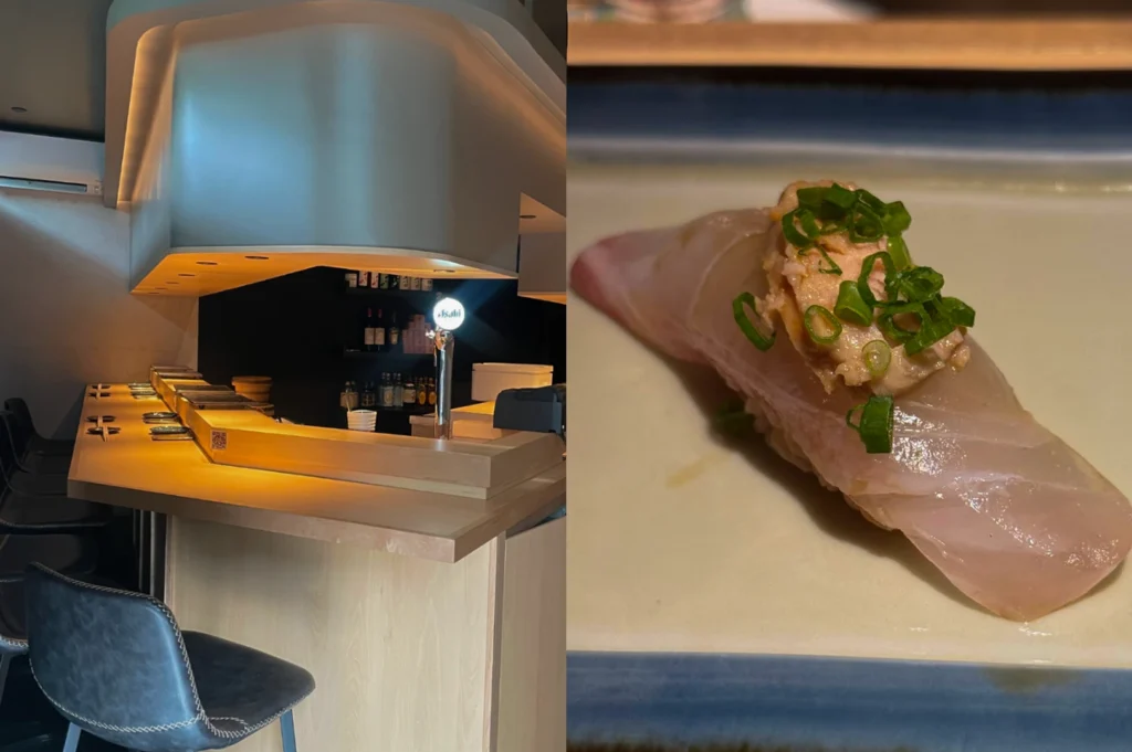 This split-screen image highlights a minimalist, modern sushi bar interior alongside a single piece of premium nigiri. On the left, an empty L-shaped light wood counter is illuminated by soft under-counter lighting, featuring a sleek metallic beer tap with an illuminated Asahi sign and a row of dark leather bar stools tucked neatly underneath. On the right, a close-up macro shot displays a pristine piece of pale white fish nigiri sushi resting on a blue-rimmed rectangular plate, elegantly garnished with a savory paste and finely chopped green onions.
