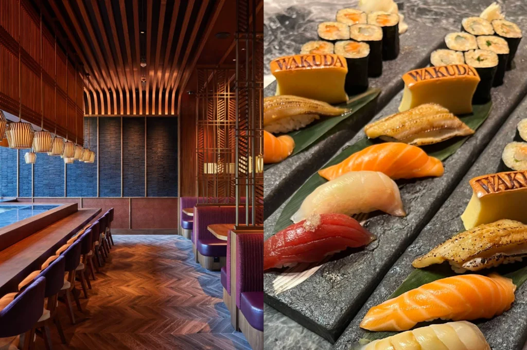 A split composition featuring a moody, upscale restaurant interior on the left and a slate platter of premium sushi on the right. The left panel shows a dining room with wooden slat ceiling details, plush maroon leather booth seating, and low-slung counter seating with purple chairs. The right panel displays a close-up of arranged sushi including tuna, salmon, and eel nigiri alongside maki rolls, accompanied by yellow tamago pieces branded with the word "WAKUDA."